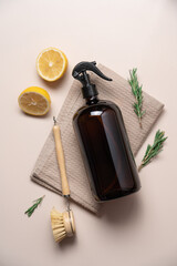 Eco-friendly cleaning product with lemon and rosemary on beige background with copy space. Zero...