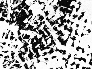 Abstract black and white texture featuring chaotic patterns reminiscent of torn paper on a textured surface