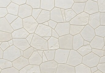 Irregularly Shaped Beige Natural Stone Wall Texture With Wide Grout Lines Creating Geometric Patterns Background