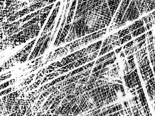 Intricate patterns of white and black lines created by marking on a rough surface during daylight...