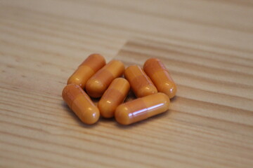 pills on a wooden table