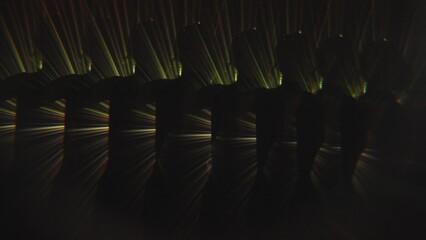 Abstract silhouette pattern with golden light beams and multiple reflections