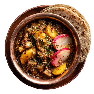 Sikkimese phagshapa pork with radish curry in copper bowl, served with buckwheat roti, isolated on a white background