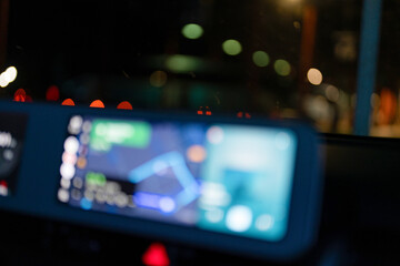 Blurred Navigation Screen Inside a Car at Night, Driving with GPS at Night