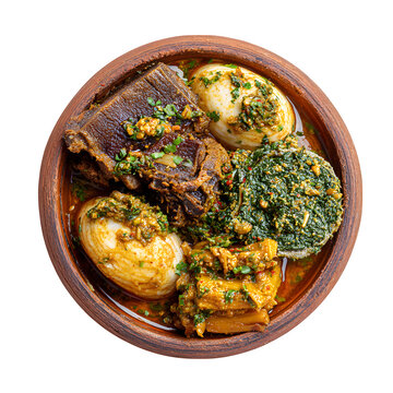 Yoruba amala with ewedu soup and assorted meats in a local clay dish, isolated on a white background