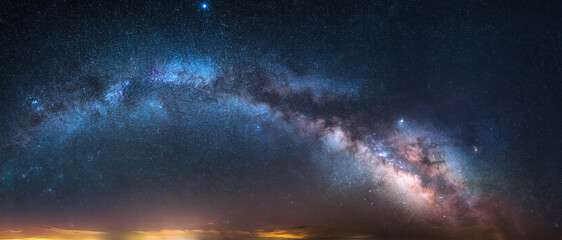 The Milky Way galaxy stretches across the night sky, revealing countless stars and cosmic wonders...