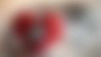 Softly blurred red and beige gradient with subtle grain texture