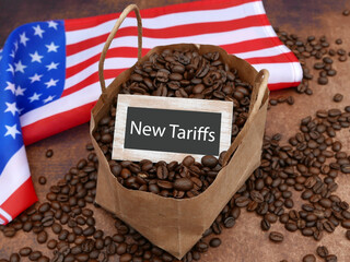 Tariff on coffee: coffee beans with the flag of the USA and the text new tariffs.