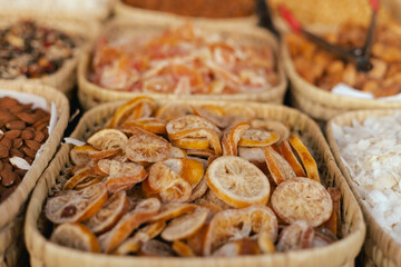 Dried fruit on sale at outdoor farmer market. The fruit shrinks during this process, leaving a small, energy-dense dried fruit. Organic produce. Close up. Part of the series