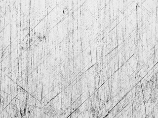 Textured surface with deep scratches and lines creates an industrial feel in a well-worn environment