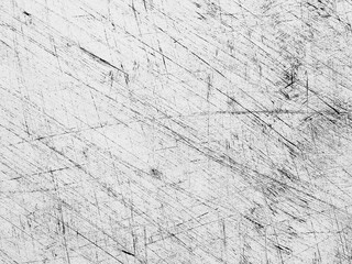 Textured surface with scratches and marks in black and white highlighting wear and age over time