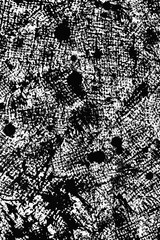 Dark abstract texture with black and white patterns resembling chaotic brush strokes and splatters,...
