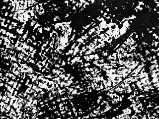 Abstract black and white texture resembling chaotic brush strokes created on a canvas in a creative...