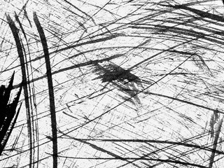 Abstract composition of bold black lines and textures on a white background created with charcoal...