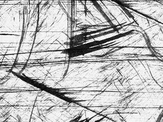 Dark strokes create abstract patterns on a white background showcasing artistic expression and...