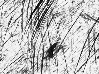 Abstract black and white lines create a striking texture on a textured surface in an artful...