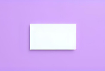 A blank business card mockup lying flat on purple background, sharp edges, top-down view, ideal for personal branding or minimalist identity design.