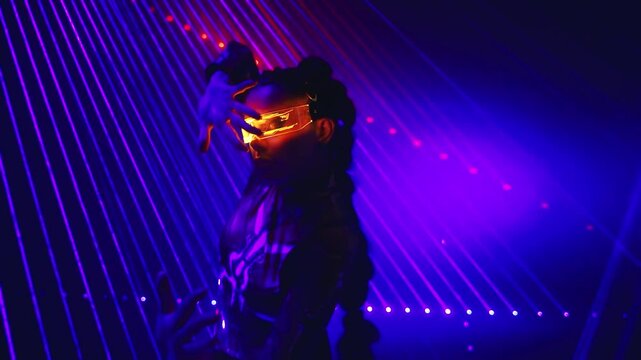 silhouette of alien Fantasy cyborg woman robot costume glowing glasses metal body cyber style. Sexy girl in virtual reality game lady warrior future vr laser light blue smoke. Fashion model posing 4k