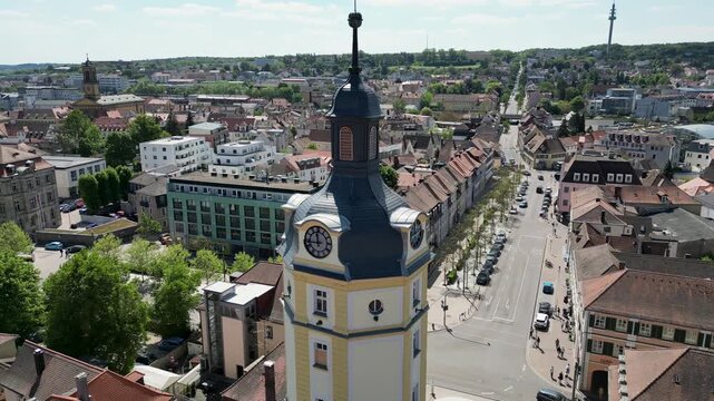 4K Aerial Drone Video of the Historic Herrieder Clock Tower in the Old Town area of Downtown Ansbach, Germany
