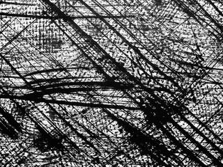 Artistic expression through dynamic black and white line patterns on a textured surface