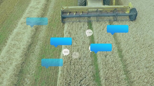 Upon drone entering frame, yellow combine cutting wheat and spawning chat bubbles to show messages