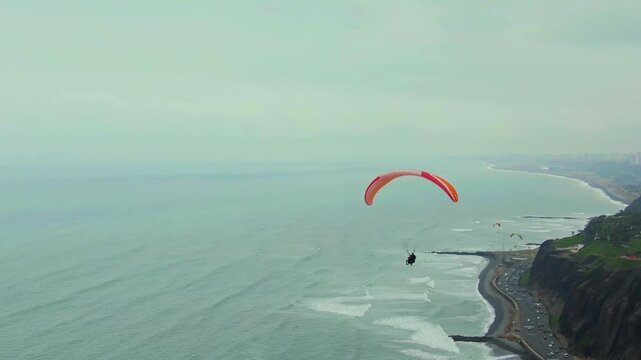 Paragliding over the ocean near the Costa Verde in Miraflores, Lima, with stunning aerial views