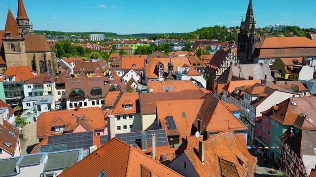 4K Aerial Drone Video of the Historic St. Johannis Church and St. Gumbertus Church in the Old Town area of Downtown Ansbach, Germany