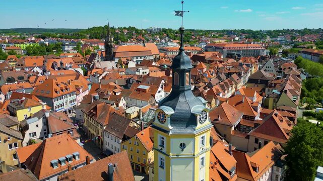 4K Aerial Drone Video of the Historic Herrieder Clock Tower in the Old Town area of Downtown Ansbach, Germany