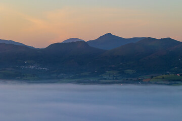 Mountains of the La Rhune Range Emerging from a Sea of Clouds at Sunrise in Sare