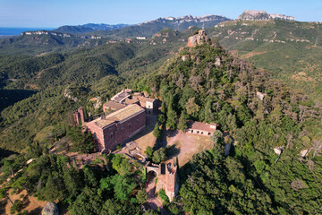 Drone view of Monestir d'Escornalbou castle on sunny day. Riudecanyes, Tarragona, Spain.