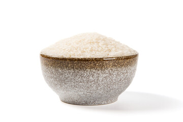 a bowl of raw rice isolated on white background 