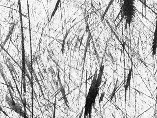 Artistic black and white abstract background with dynamic scratch patterns and textures