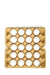 Top view of white chicken eggs in the cardboard egg tray with rooms for twenty eggs isolated on white background, with clipping path included