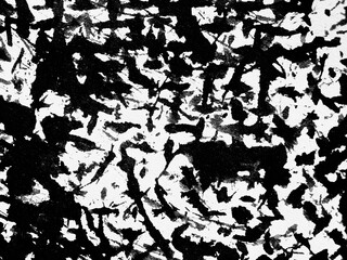 Artistic monochrome pattern showcasing dynamic black and white abstract shapes on textured surface