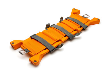 Orange foldable emergency stretcher with grey straps and metal rings on a white background