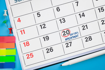 Red circle on calendar with Doctor's appointment reminder. Health care concept, and annual health...