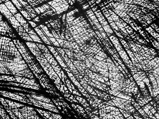 Intricate patterns of black lines on a white background showcase artistic expression in a creative workspace