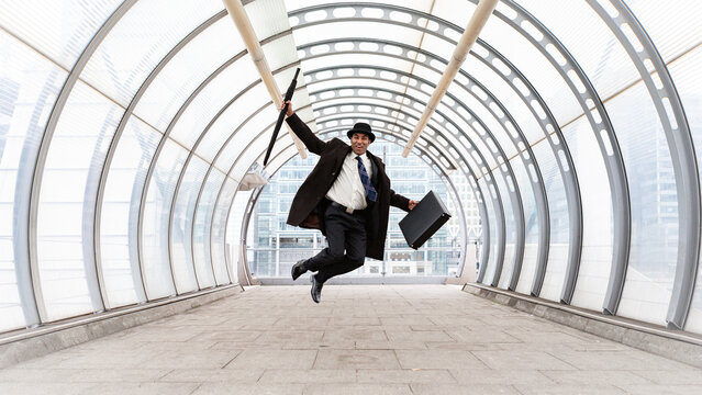 The City Gent, Jumping for Joy. A traditional London financial business man celebrating his bonus. From a related image series. - Powered by Adobe