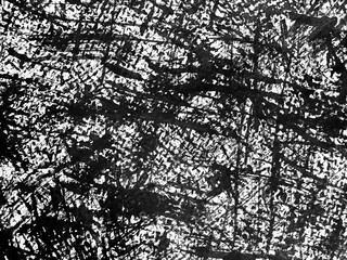 Black and white abstract artwork featuring intricate textures and lines created through a unique artistic process