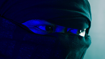 Masked male close-up with blue and green ambient light, mysterious ninja-style eyes highlighted in...
