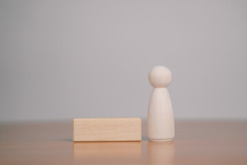 Several wooden blocks are placed on a table with a white background.	