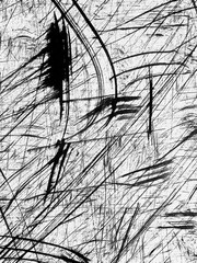 Abstract black and white lines create dynamic patterns on a textured surface in a modern art setting