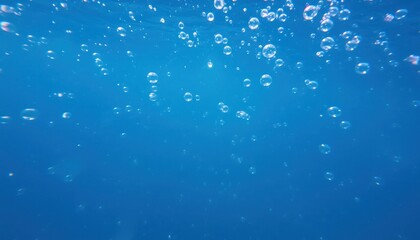 Underwater Scene with Bubbles Rising Towards the Surface in Blue Water