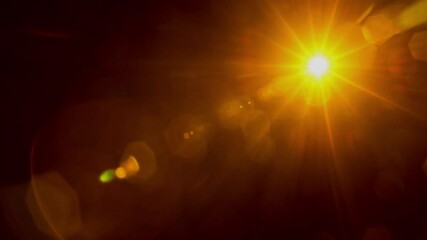 Real flare lens that is easy to use in blend or overlay modes. Natural lens flare from the sun.
High-quality stock footage of sun rays light effects, Rotation orange sun lens flare background. - Powered by Adobe
