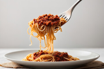 Superb Spaghetti rolled on a fork, close-up