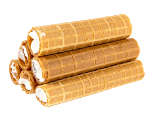 Wafer rolls filled with a creamy filling are stacked, creating a tempting presentation on a transparent background