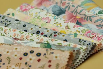 Cotton fabric scraps for sewing. Natural multi-colored fabric close-up. Textiles for handicrafts.