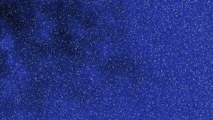 宇宙の微粒子を想起させるブルーテクスチャ背景