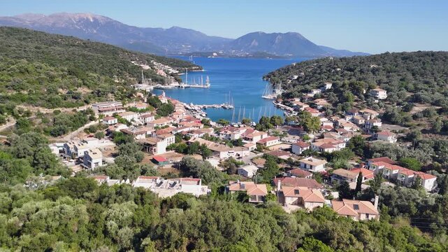 Flyover Vathy, Greece reveals boats moored in peaceful ocean bay