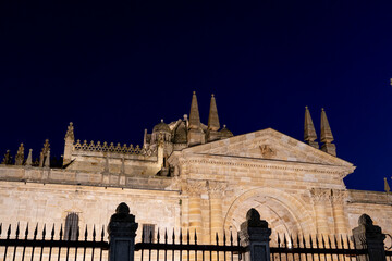 Historic architecture of Zamora at night showcasing intricate details and unique spires